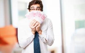 Young man holding american cash